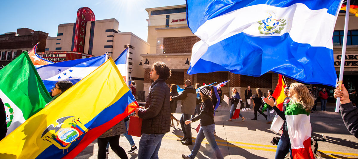International Studies students hold their country's flags.